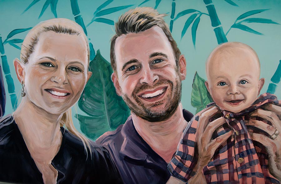 Family portrait painted onto a new custom-shaped surfboard